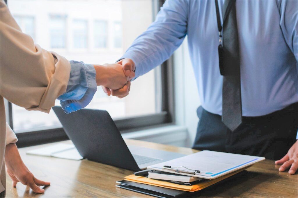 Trusted Financial Adviser - people shaking hands